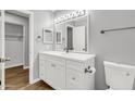 Bathroom featuring a white vanity with a modern sink and fixtures, and neutral wall paint at 4735 S Mill Ave, Tempe, AZ 85282