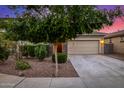 Home featuring a two-car garage, stone accents, and low maintenance landscaping at 5752 N 109Th Ave, Phoenix, AZ 85037