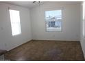 Bright living room with large windows, neutral paint, and tile flooring at 7807 E Main St # H7, Mesa, AZ 85207