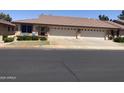 A row of well-maintained homes with two-car garages, showcasing the community's curb appeal at 11360 E Keats Ave # 75, Mesa, AZ 85209