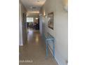 Inviting hallway with tile flooring leading to the living and dining areas at 11360 E Keats Ave # 75, Mesa, AZ 85209