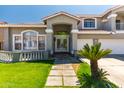 Charming front entrance with a double door and decorative stonework at 13323 W Rancho Dr, Litchfield Park, AZ 85340