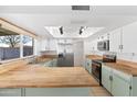 Spacious kitchen with butcher block countertops and stainless steel appliances at 18629 N 10Th Ave, Phoenix, AZ 85027