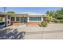 Rear exterior showing brick and painted wood with desert landscaping at 1945 E Solano Dr, Phoenix, AZ 85016