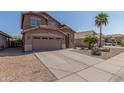 Inviting exterior of a well-maintained home featuring desert landscaping and a concrete driveway at 19933 N Emmerson Dr, Maricopa, AZ 85138