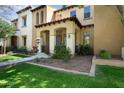 Charming townhome with a well-manicured lawn and attractive landscaping elements enhances the curb appeal at 21109 W Sunrise Ln, Buckeye, AZ 85396