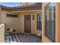 Inviting covered front entry with decorative wreath on the front door at 2145 N 88Th St, Mesa, AZ 85207