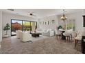 Bright living room features neutral colors, modern furnishings, and access to the outdoor patio at 2145 N 88Th St, Mesa, AZ 85207