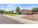 Nice home featuring desert landscaping, an extended driveway, and a two-car garage at 2585 E Morgan Dr, Gilbert, AZ 85295