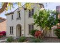 Charming two-story home with a well-maintained yard and beautiful front door at 28967 N 124Th Ave, Peoria, AZ 85383