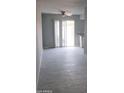 Bright living room with a sliding glass door leading to a yard at 3605 W Bethany Home Rd # 7, Phoenix, AZ 85019