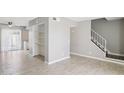 View of an empty living room with wood floors, and a stairway to the second level at 3605 W Bethany Home Rd # 7, Phoenix, AZ 85019