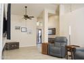 Spacious living area featuring tile floors, a high ceiling, and an abundance of natural light at 441 E Encinas Ave, Gilbert, AZ 85234