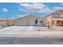 Inviting single-Gathering home featuring a desert landscape, two-car garage, and a charming front patio at 46141 W Amsterdam Rd, Maricopa, AZ 85139
