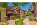 Charming condo exterior with well-maintained landscaping and inviting walkway, enhancing curb appeal at 700 E Mesquite Cir # N125, Tempe, AZ 85288