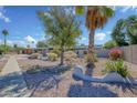 Well-maintained single Gathering home with desert landscaping including cacti and gravel ground cover at 11035 N 37Th St, Phoenix, AZ 85028