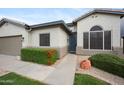 Inviting single-story home with well-maintained landscaping and a cozy entrance walkway at 1748 E Cortez Dr, Gilbert, AZ 85234