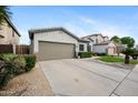 Well-maintained single-story home boasting a spacious driveway and low-maintenance desert landscaping at 1748 E Cortez Dr, Gilbert, AZ 85234