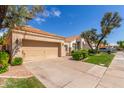 Attractive single-story home with a two-car garage and well-manicured lawn at 221 N Ironwood St, Gilbert, AZ 85234
