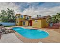 Backyard featuring a refreshing private swimming pool, well manicured yard and an outdoor entertaining space at 3121 W Greenway Rd, Phoenix, AZ 85053