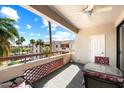 This balcony view features a table, chairs and a door leading into the unit, offering a seamless indoor-outdoor living at 4200 N Miller Rd # 503, Scottsdale, AZ 85251
