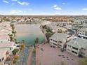 Community aerial view overlooking lake, highlighting nearby homes and condos at 16013 S Desert Foothills Pkwy # 2130, Phoenix, AZ 85048