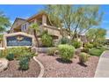 Attractive condominium exterior with lush landscaping and community sign at 16013 S Desert Foothills Pkwy # 2130, Phoenix, AZ 85048