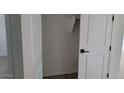 A walk-in closet with shelving offers storage for shoes, accessories and more at 18256 W La Senda Dr, Surprise, AZ 85387