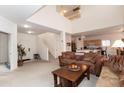 Bright, open-concept living room with staircase and views of the kitchen at 2749 S Powell Rd, Apache Junction, AZ 85119