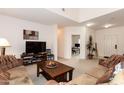 Cozy living room featuring a television and neutral carpet at 2749 S Powell Rd, Apache Junction, AZ 85119