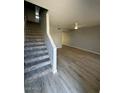 Spacious living room with new floors extending to the staircase at 3840 N 43Rd Ave # 71, Phoenix, AZ 85031