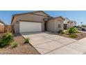 Lovely, one-story home with a spacious driveway, neutral stucco exterior, and low-maintenance desert landscaping at 47859 W Moeller Rd, Maricopa, AZ 85139