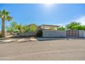 View of backyard featuring covered patio and privacy wall at 6333 W Banff Ln, Glendale, AZ 85306
