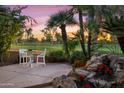Private patio area surrounded by mature trees and professional landscaping and golf course views at 7425 E Gainey Ranch Rd # 13, Scottsdale, AZ 85258