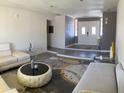 Bright living room showcasing modern furniture, neutral walls, and stylish flooring at 8609 S 16Th St, Phoenix, AZ 85042