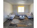 Spacious living room with recessed lighting, neutral walls and modern furnishings at 8609 S 16Th St, Phoenix, AZ 85042
