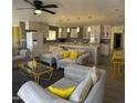 Bright, open concept living room and kitchen featuring recessed lighting and comfortable seating at 8609 S 16Th St, Phoenix, AZ 85042