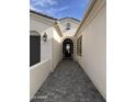 Beautifully tiled entryway to the home, features intricate brick design and lovely architectural details at 1185 E Gleneagle Dr, Chandler, AZ 85249