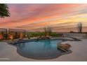 Backyard with desert views featuring a unique pool with cascading rock waterfall at 25871 N 113Th Way, Scottsdale, AZ 85255