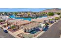 Waterfront home with a well-manicured yard and a peek of the refreshing pool at 5252 W Pontiac Dr, Glendale, AZ 85308