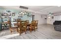 Bright dining area with stylish décor, wood table, and light-colored walls at 7357 W Cheryl Dr, Peoria, AZ 85345