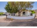 Attractive home with a well-kept front yard, attached two car garage and attractive landscaping at 2701 E Caldwell St, Phoenix, AZ 85042