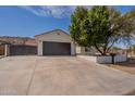 Well-maintained home boasting an attached two-car garage and landscaped yard enhancing its curb appeal at 2701 E Caldwell St, Phoenix, AZ 85042