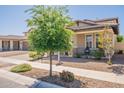 This home showcases a well-maintained lawn, desert landscaping, covered front porch, and a charming neighborhood setting at 3871 E Harrison St, Gilbert, AZ 85295