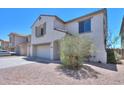 Charming home with a three-car garage, desert landscaping, and a welcoming exterior at 43601 W Cowpath Rd, Maricopa, AZ 85138