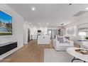 Bright, open living space with modern kitchen, island, and stylish furnishings, with hardwood style floors throughout at 8522 E Virginia Ave, Scottsdale, AZ 85257