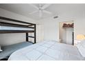 This bedroom has a bunk bed, queen bed and closet perfect for sleep and storage at 10410 N Cave Creek Rd # 1100, Phoenix, AZ 85020