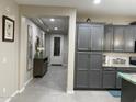 Stylish hallway with modern decor, neutral colors, and easy access to other rooms in the home at 11562 W Levi Dr, Avondale, AZ 85323