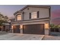 Attractive two-story house showcasing a well-maintained driveway and a roomy two-car garage at 12376 W Hazelwood St, Avondale, AZ 85392