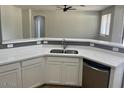 Bright kitchen featuring quartz countertops, stainless steel appliances, and a breakfast bar at 15461 W Jefferson St, Goodyear, AZ 85338